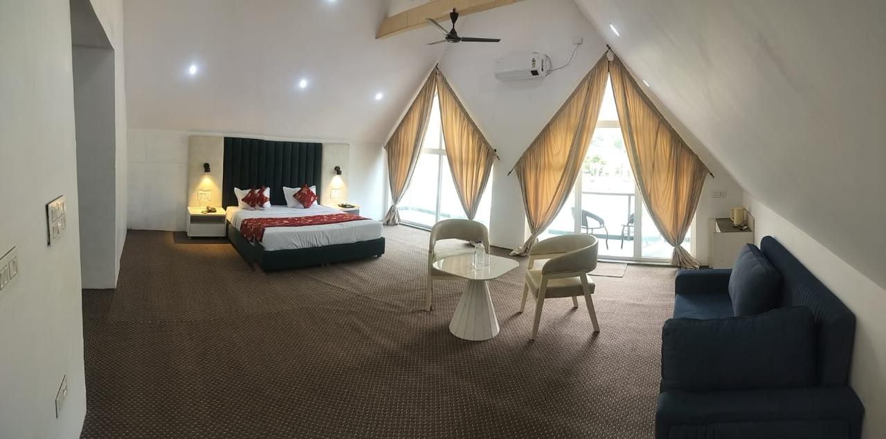 Spacious attic suite with sloping ceilings and a seating area