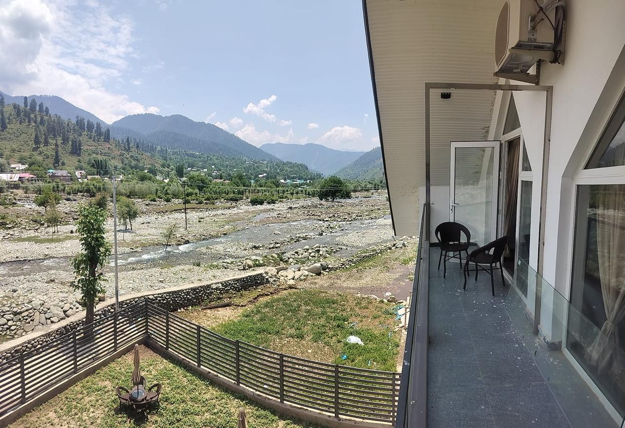 Lotus Villa balcony overlooking the river and green mountain valley
