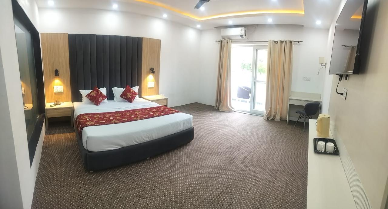 Lotus Villa guest bedroom with a double bed and balcony access