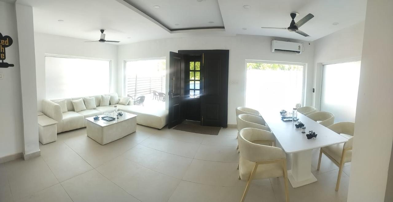 Bright shared lounge and dining space at Lotus Villa